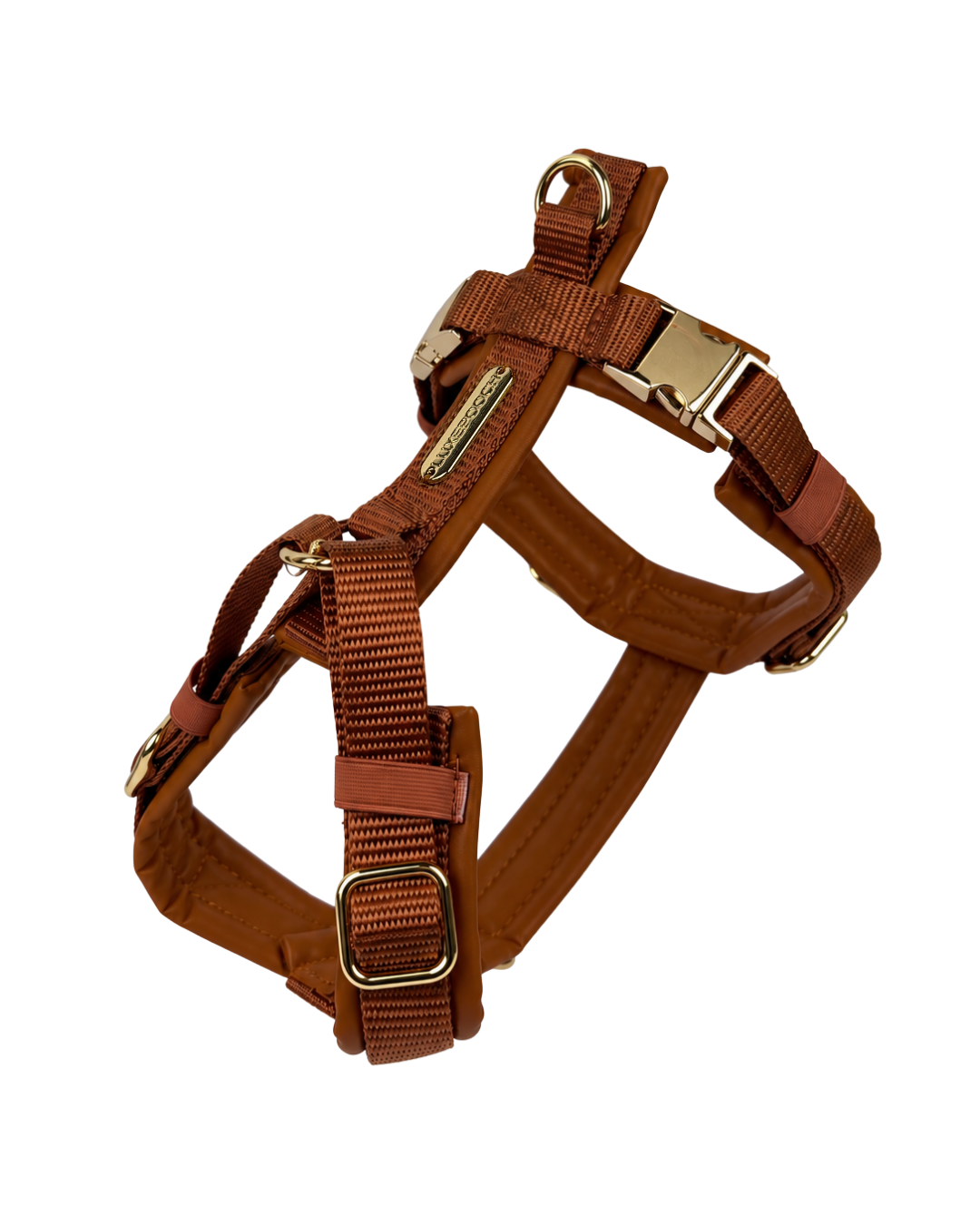 A brown nylon dog harness with adjustable buckles and leather-like trim, displayed on a clean white background.
