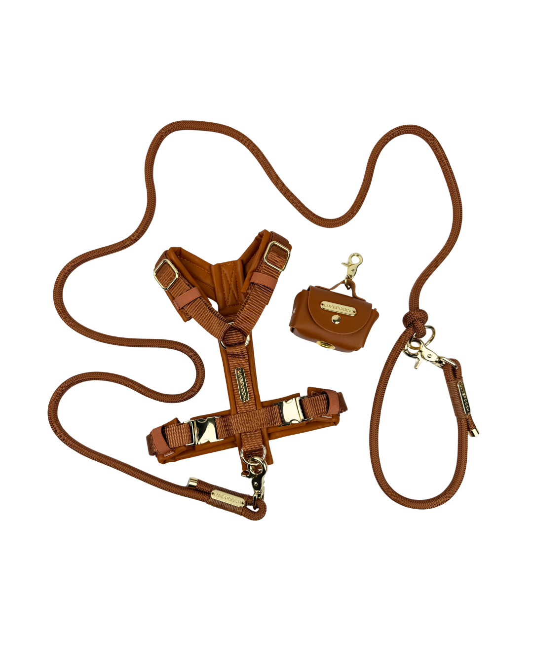 Brown dog harness, brown nylon rope leash, brown poop bag dispenser displayed as a matching set.